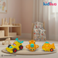 Three colorful toy vehicles on a mat with a child's room in the background, featuring the Kidliva brand.